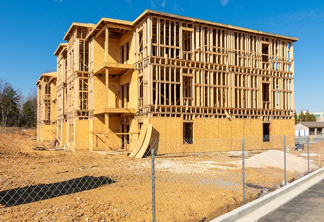 a snapshot of temporary chain link fences protecting a large construction project from unauthorized access in Carlisle, MA